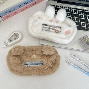 Detail view of plush animal pencil cases with transparent window for stationery storage