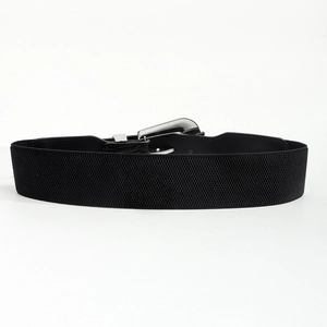 Detail view of black wide elastic waist belt with silver buckle and crocodile texture