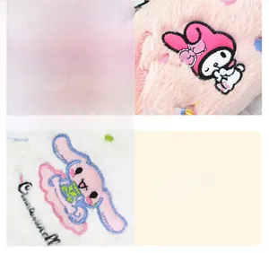 Detail of soft corduroy fabric featuring Cinnamoroll and My Melody character embroidery