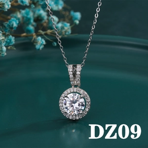 Macro view of 2ct round cut halo pendant necklace with polished silver finish