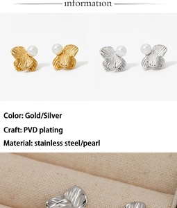 Macro detail of PVD plated stainless steel flower earrings with centered pearls