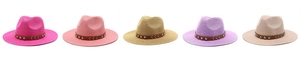 Group of colorful straw cowboy hats with studded leather bands in five different colors