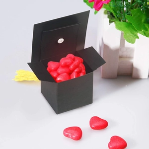 Black graduation cap candy box with yellow tassel and red heart sweets for graduation gifts