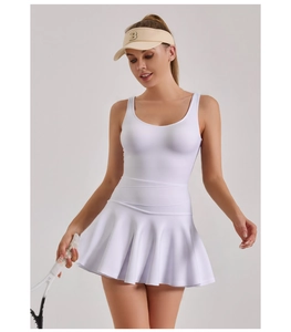 Detail of white athletic dress with pleated hem and sleeveless design for tennis sports