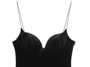 Detail of black velvet camisole top featuring thin straps and elegant sweetheart neckline