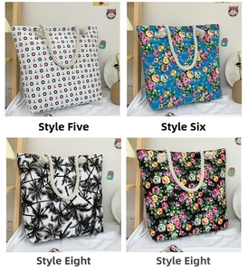 Detail view of canvas tote bags with thick cotton rope handles and floral patterns