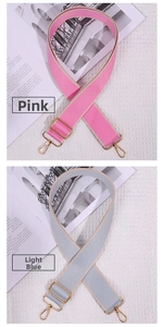 Detail of pink and light blue woven replacement shoulder straps with gold metal hooks