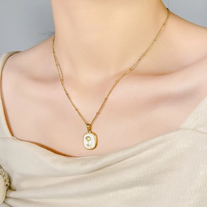 Elegant gold rose pendant necklace with enamel inlay on a delicate bead chain for women