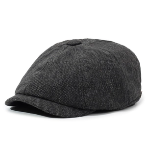 Side view of dark gray textured cotton linen newsboy cap with classic retro herringbone pattern