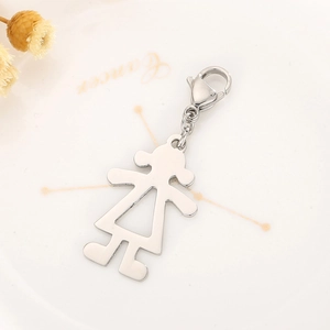 Polished stainless steel girl silhouette pendant with lobster clasp on elegant ceramic plate