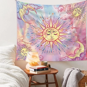 Detailed view of the sun and moon tapestry hanging above a bed in a cozy bedroom
