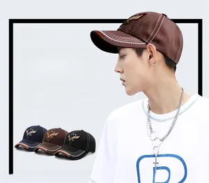 Detailed embroidery of an eagle on cotton baseball caps in brown, navy, and black colors
