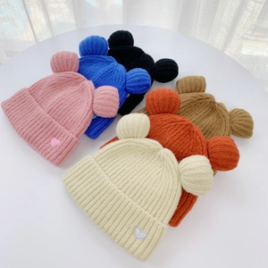 Detailed group view of colorful knit bear ear beanies with cute heart patches