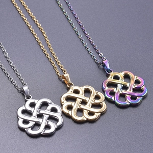 Detailed view of three Celtic witch knot pendants in silver, gold, and rainbow finishes