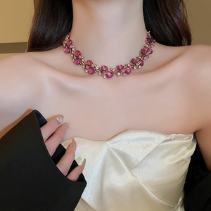 Detail of vintage flower necklace with pink purple stones and sparkling crystals