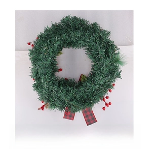 Rear view of Christmas wreath featuring green pine needles, red berries and buffalo plaid bow
