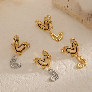 Minimalist double heart stud earrings in gold and silver with sparkling stones and black enamel