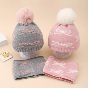Winter knit baby hat and scarf set with jacquard bows and plush pom poms in pink and grey