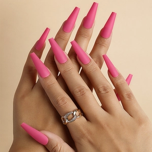 Elegant matte pink long coffin press-on nails set shown on hands with a gold ring