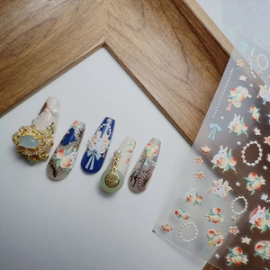 3D embossed nail stickers featuring rabbit motifs and peach blossom ornaments
