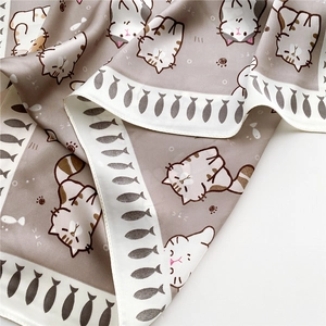 Silk square scarf with cartoon cat patterns and fishbone border in a soft draping style