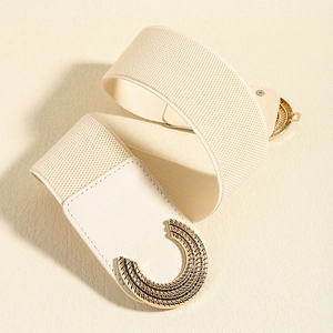 Close-up of elastic waist belt with gold interlocking C-buckle and radial wave texture