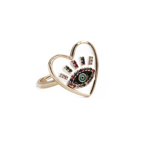Detail view of heart-shaped ring with colorful zircon evil eye motif on white background
