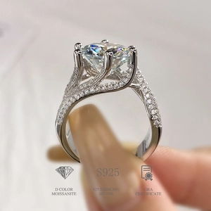 Macro shot of 925 sterling silver ring with three rows of D color moissanite stones