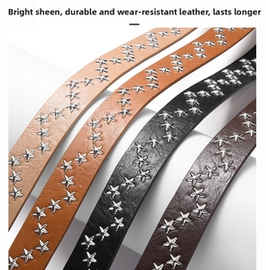 Close-up of four studded leather belts with silver star rivets in various shades of brown and black