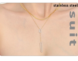 Detail of double layered 18K gold plated stainless steel snake chain and oval pendant necklace