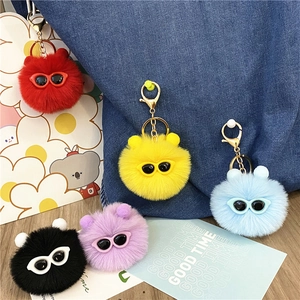 Plush fur ball keychains with cute sunglasses in various colors for bag decoration