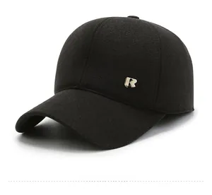 Detailed side view of black wool winter baseball cap with gold metal R logo