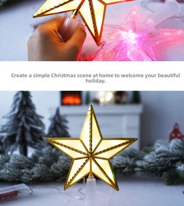Detail view of glowing LED Christmas star topper with warm white and purple lights
