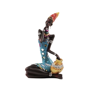 Artistic resin African woman figurine in blue dress and red headscarf with gold pot