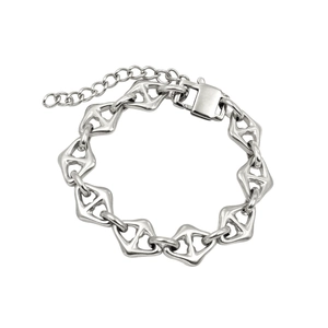 Detail of silver geometric link bracelet with secure clasp and extension chain on white background
