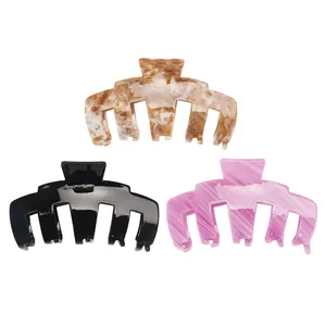 Three-piece set of large acetate hair claws in tortoise, black, and striped patterns