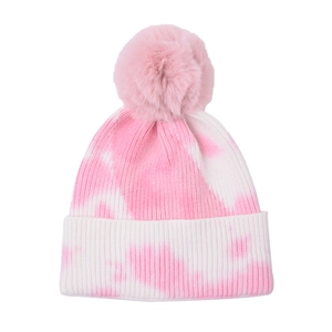 Detailed close-up showing the pink and white tie-dye knit texture and faux fur pompom