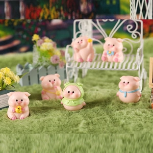 Detailed view of six miniature pink resin pig figurines in a cozy micro garden setting