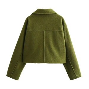 Back view detail of a dark grass green wool jacket featuring premium tweed texture and stitching