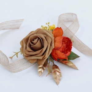 Champagne rose and orange peony wedding corsage with linen ribbon on white background
