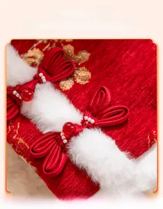 Close-up of rabbit-shaped traditional Chinese knots with gold plum embroidery on pet vest