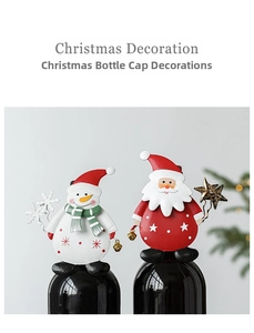 Detail of metal Christmas wine bottle toppers featuring Santa and Snowman holiday figures