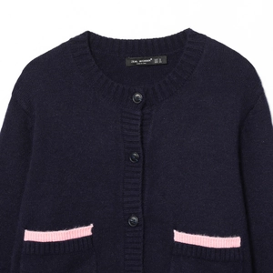Women's dark blue knit cardigan featuring pink contrast trim and decorative pockets