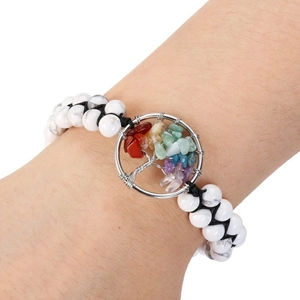 Close-up of double-layer beaded bracelet featuring a colorful gemstone Tree of Life charm