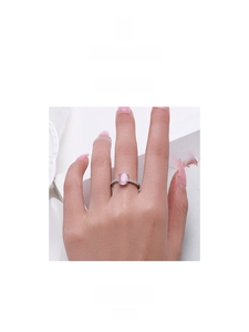 Detailed close-up of S925 sterling silver ring featuring a pink cat's eye stone setting