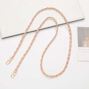 Pink leather interwoven with golden metal chain strap featuring lobster clasps