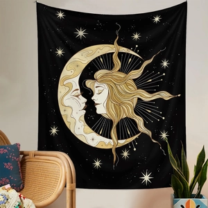 Detailed view of bohemian sun and moon tapestry hanging in a cozy living room setting