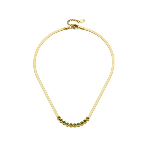 Detail of gold snake chain necklace with vibrant green round-cut gemstone inlay