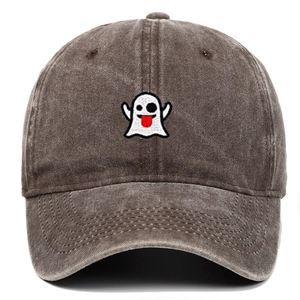 Close-up of cute ghost embroidery on vintage washed cotton baseball cap texture