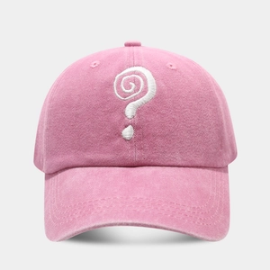 Detail shot of white spiral embroidery on pink washed cotton vintage baseball cap